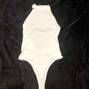 White bodysuit, high neck